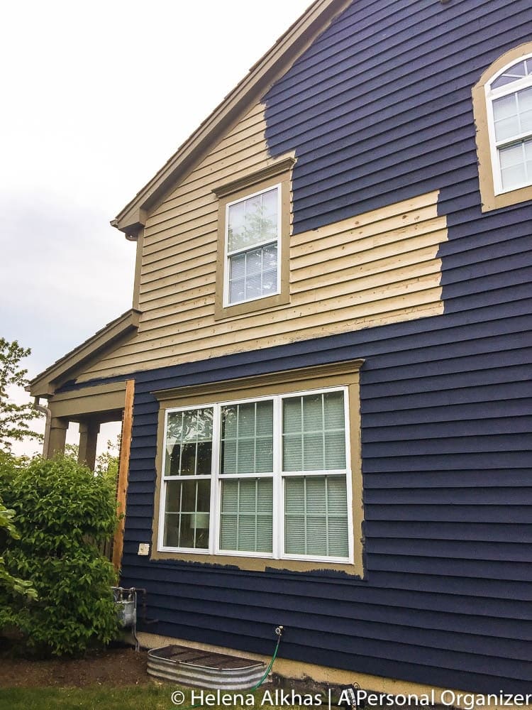 side of house being painted with Hale Navy by Benjamin Moore