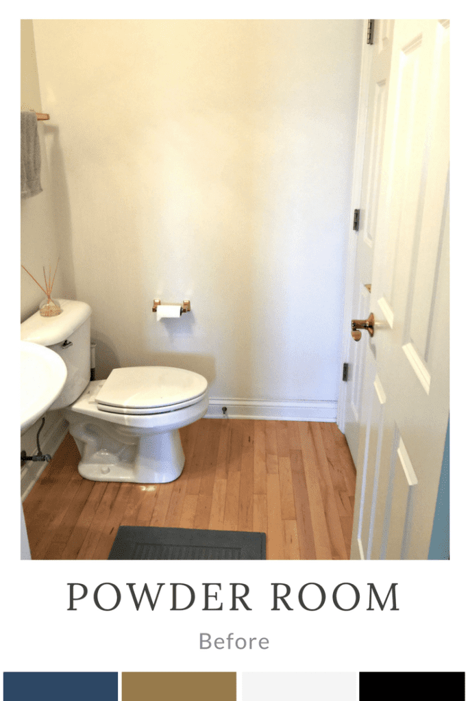 small bathroom with white walls and gold fixtures.