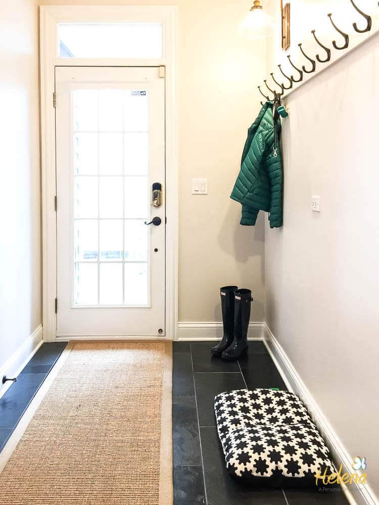 Mudroom with external door and hooks on wall