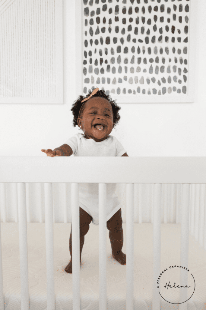 happy baby jumping in her crib